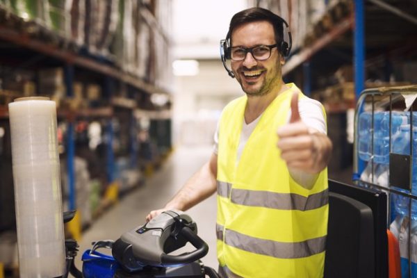 distribution-warehouse-worker-with-headset-communication-organizing-goods-delivery_342744-1480